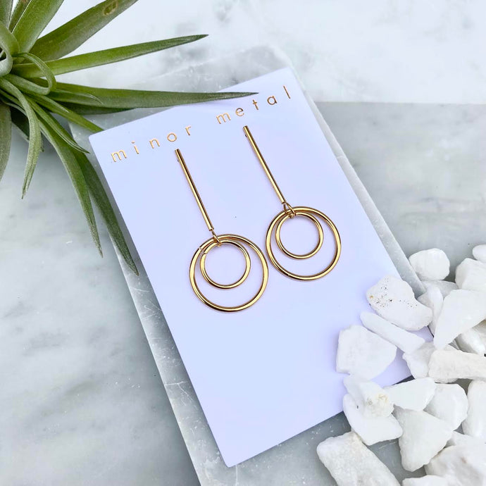 orbit dangle earrings